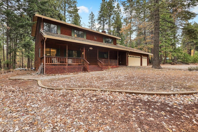 31272 Woodridge Dr, Shingletown, CA 96088 - rustic home featuring a porch and an attached garage