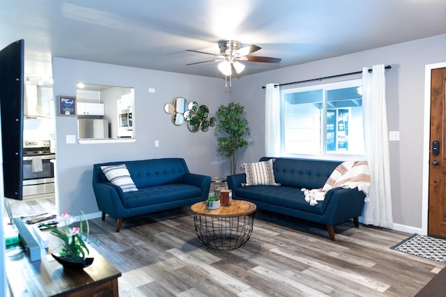 1018 Pineland Dr, Redding, CA 96002 - living area with a ceiling fan, wood finished floors, and baseboards