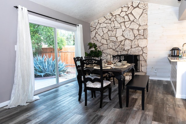 1018 Pineland Dr, Redding, CA 96002 - dining space featuring vaulted ceiling, dark wood finished floors, and baseboards