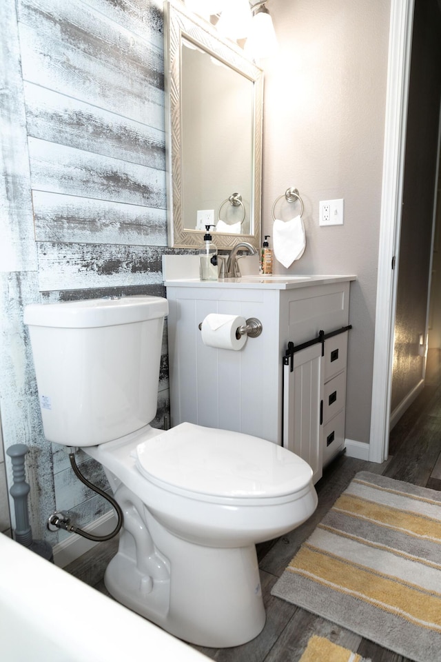 1018 Pineland Dr, Redding, CA 96002 - half bath featuring wood finished floors, toilet, and vanity