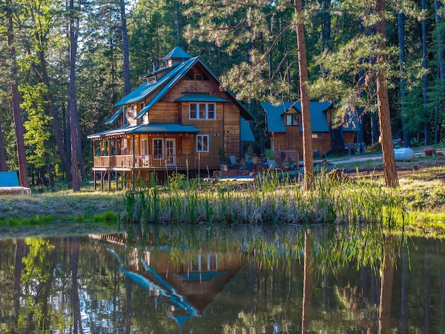7704 Eastmoore Rd, Shingletown, CA 96088 - rear view of property featuring a deck with water view