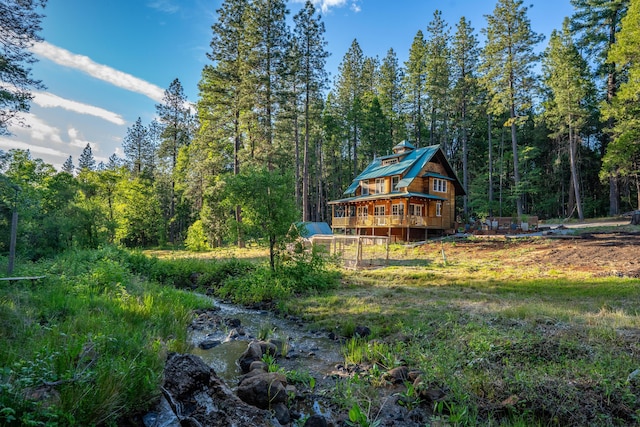 7704 Eastmoore Rd, Shingletown, CA 96088 - view of yard with a forest view and a deck