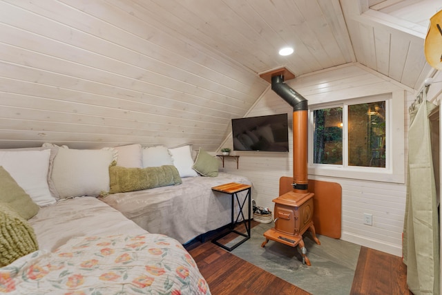 7704 Eastmoore Rd, Shingletown, CA 96088 - bedroom with vaulted ceiling, a wood stove, wood finished floors, and wood ceiling