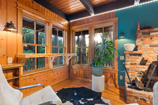 7704 Eastmoore Rd, Shingletown, CA 96088 - living area featuring wood ceiling, wooden walls, beam ceiling, wood finished floors, and baseboards