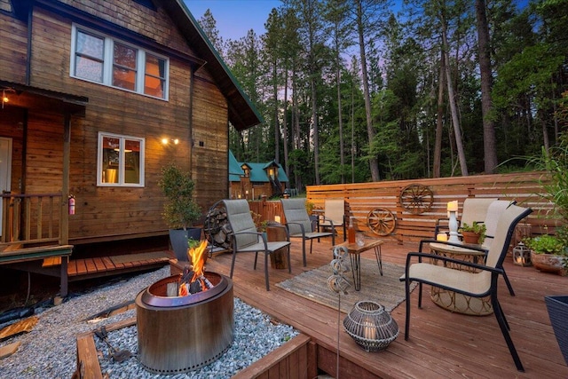 7704 Eastmoore Rd, Shingletown, CA 96088 - wooden terrace with a fire pit
