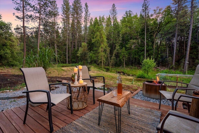 7704 Eastmoore Rd, Shingletown, CA 96088 - wooden terrace featuring an outdoor fire pit