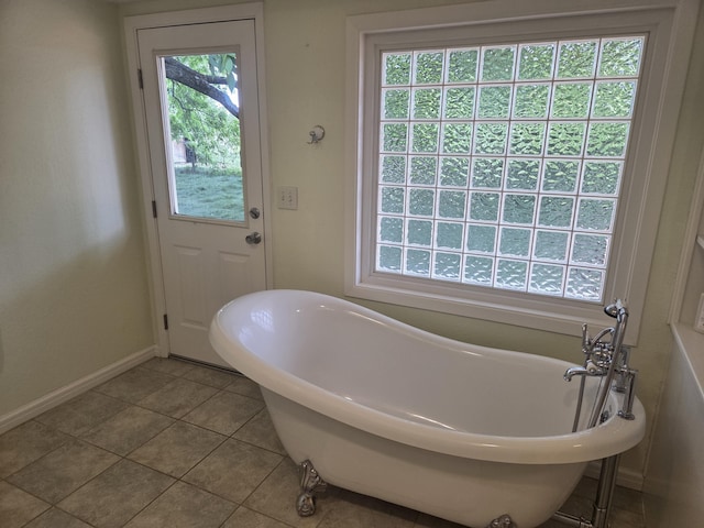 8198 Green Acres Ln, Redding, CA 96002 - bathroom with a soaking tub, tile patterned flooring, and baseboards