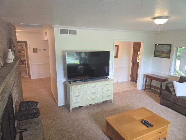 8198 Green Acres Ln, Redding, CA 96002 - living room with ornamental molding, carpet, a textured ceiling, a fireplace, and baseboards