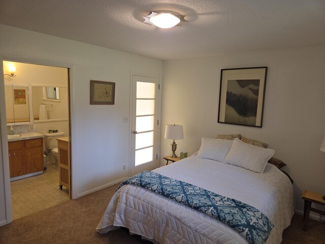 8198 Green Acres Ln, Redding, CA 96002 - bedroom with light carpet, connected bathroom, baseboards, and a sink