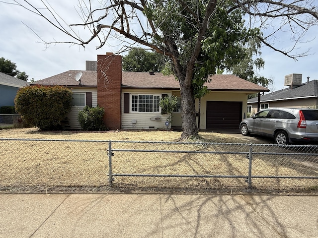 1434 Jeffries Ave, Anderson, CA 96007 - ranch-style house with a garage, concrete driveway, a fenced front yard, and a chimney