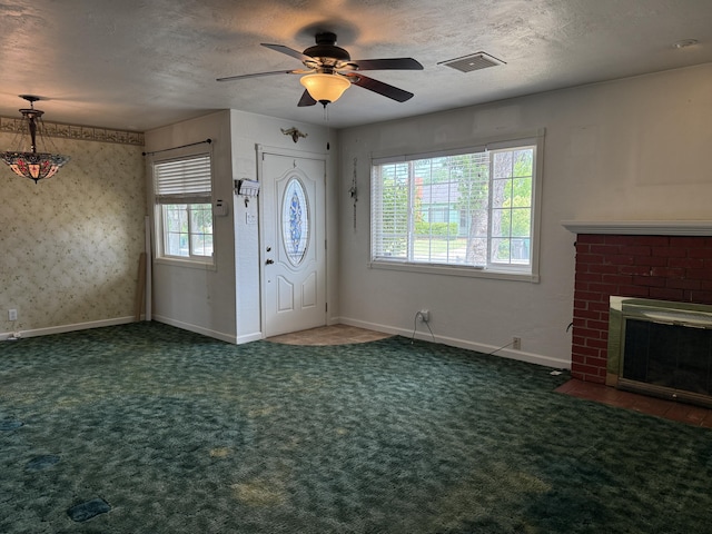 1434 Jeffries Ave, Anderson, CA 96007 - foyer featuring carpet floors, a ceiling fan, a brick fireplace, a textured ceiling, and baseboards