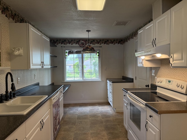 1434 Jeffries Ave, Anderson, CA 96007 - kitchen with white appliances, under cabinet range hood, a sink, and dark countertops