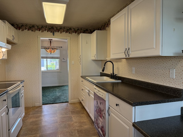 1434 Jeffries Ave, Anderson, CA 96007 - kitchen with white range with electric cooktop, dishwasher, a sink, dark countertops, and white cabinetry
