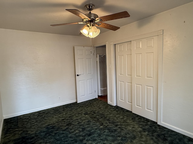 1434 Jeffries Ave, Anderson, CA 96007 - unfurnished bedroom with dark carpet, a closet, baseboards, and ceiling fan