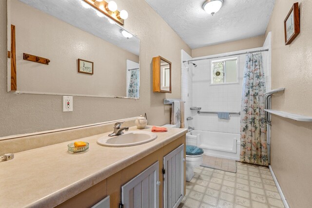 7372 Tahoe Ln, Shingletown, CA 96088 - full bath with tile patterned floors, toilet, vanity, a textured wall, and a textured ceiling