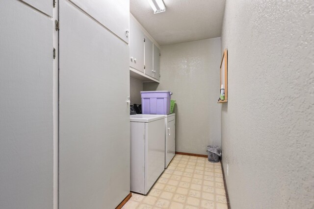 7372 Tahoe Ln, Shingletown, CA 96088 - laundry room featuring washer and clothes dryer, light flooring, cabinet space, baseboards, and a textured wall