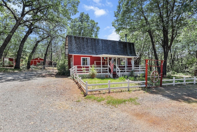 7372 Tahoe Ln, Shingletown, CA 96088 - view of front facade with a porch and a shingled roof