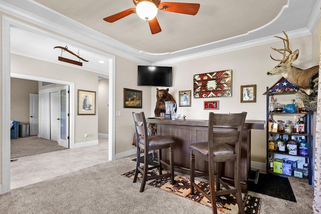 22540 Brady Ct, Red Bluff, CA 96080 - indoor bar featuring carpet flooring, crown molding, a ceiling fan, tile patterned floors, and baseboards