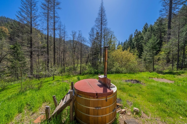 8916 Reading Creek Rd, Douglas City, CA 96024 - view of yard with a hot tub and a view of trees
