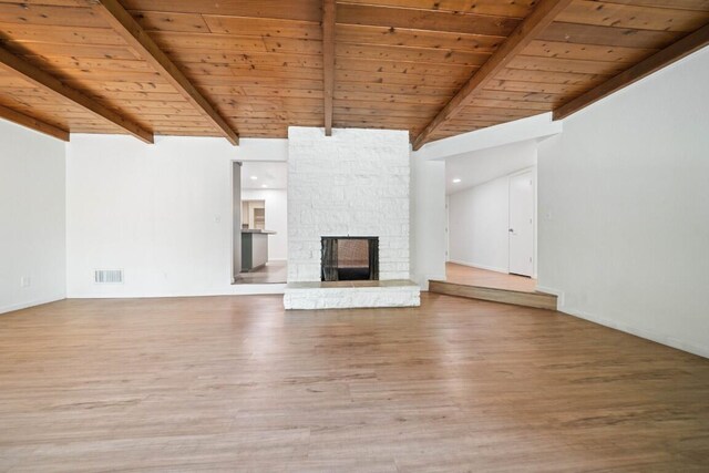 1640 Wisconsin Ave, Redding, CA 96001 - unfurnished living room with wood ceiling, wood finished floors, a fireplace, and baseboards