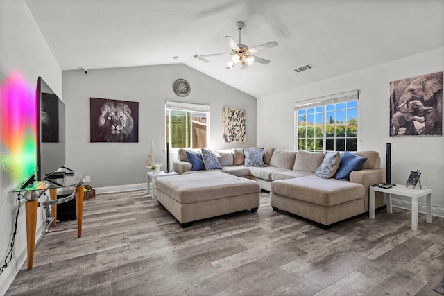 910 Montcrest Dr, Redding, CA 96003 - living area with a ceiling fan, vaulted ceiling, wood finished floors, and healthy amount of natural light