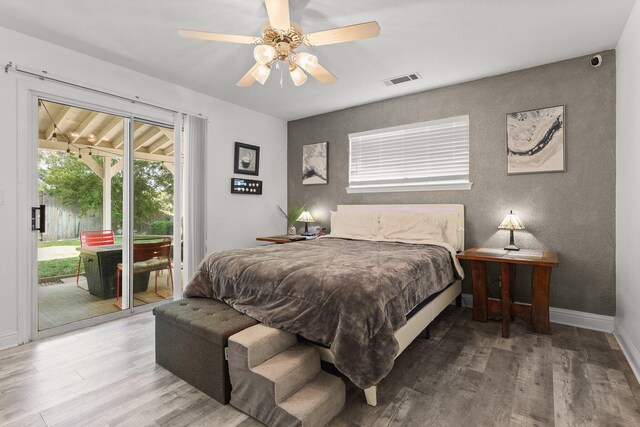 910 Montcrest Dr, Redding, CA 96003 - bedroom with access to exterior, wood finished floors, baseboards, a textured wall, and a ceiling fan