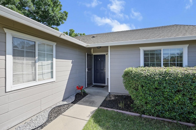 910 Montcrest Dr, Redding, CA 96003 - view of exterior entry with roof with shingles