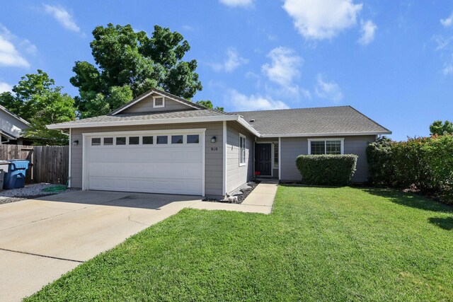 910 Montcrest Dr, Redding, CA 96003 - ranch-style house with concrete driveway, an attached garage, and roof with shingles