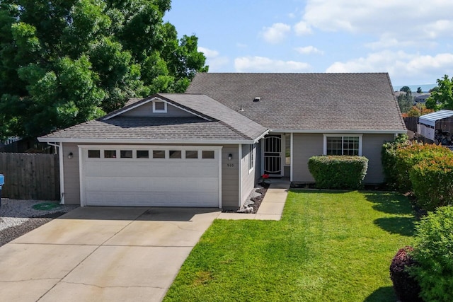 910 Montcrest Dr, Redding, CA 96003 - view of front of house featuring a garage, concrete driveway, and a shingled roof