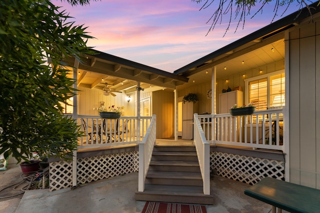 6766 Drake Dr, Anderson, CA 96007 - view of exterior entry with a ceiling fan, a porch, and board and batten siding