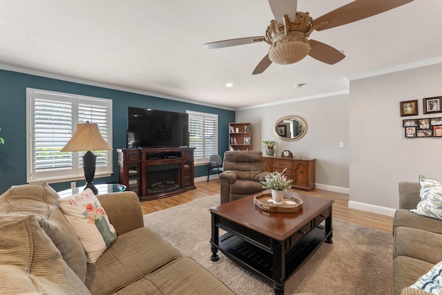 6766 Drake Dr, Anderson, CA 96007 - living room with crown molding, light wood-type flooring, baseboards, a ceiling fan, and a fireplace