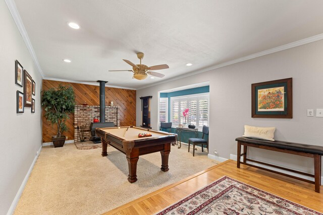 6766 Drake Dr, Anderson, CA 96007 - recreation room with a wood stove, ornamental molding, wood walls, a ceiling fan, and recessed lighting