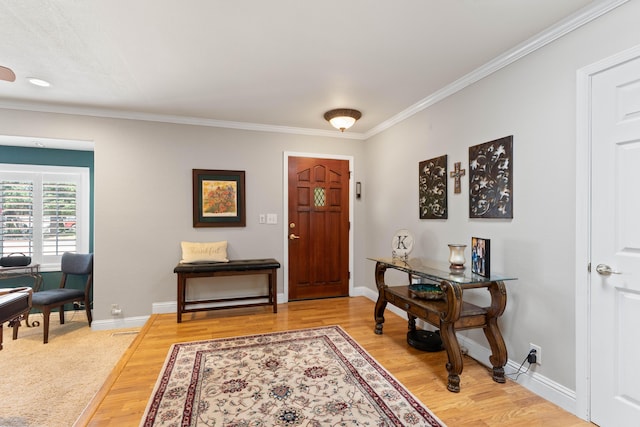 6766 Drake Dr, Anderson, CA 96007 - foyer with crown molding and light wood finished floors