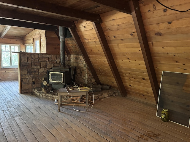 10473 Blue Mountain Ranch Rd, Whitmore, CA 96096 - unfurnished room with wooden ceiling, a wood stove, hardwood / wood-style floors, and wooden walls