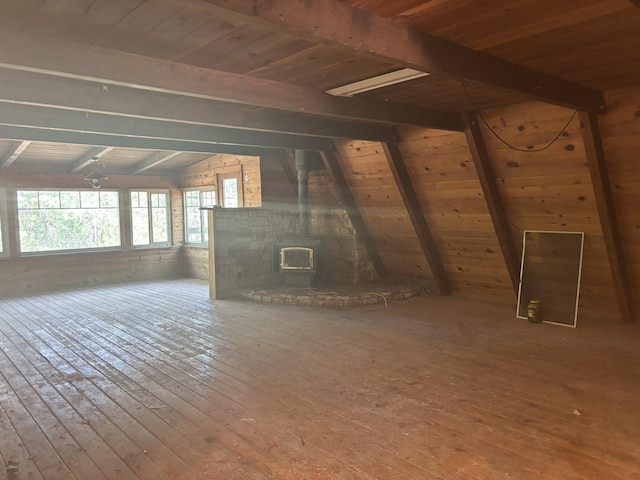 10473 Blue Mountain Ranch Rd, Whitmore, CA 96096 - unfurnished living room featuring hardwood / wood-style floors, wooden ceiling, and a wood stove