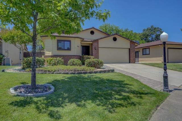 1922 Paris Ave, Redding, CA 96001 - ranch-style house featuring a garage, brick siding, concrete driveway, and a front lawn