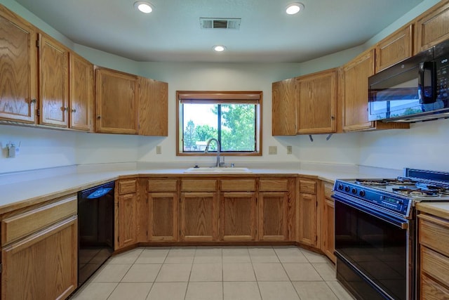 1922 Paris Ave, Redding, CA 96001 - kitchen with black appliances, a sink, light countertops, light tile patterned floors, and recessed lighting