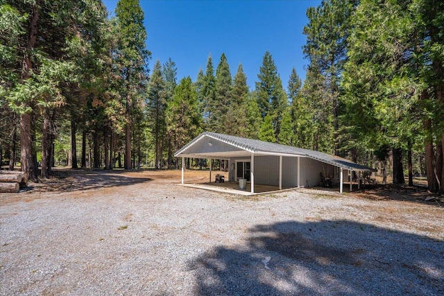 9279 Thatcher Mill Rd, Shingletown, CA 96088 - view of outdoor structure with a forest view and driveway