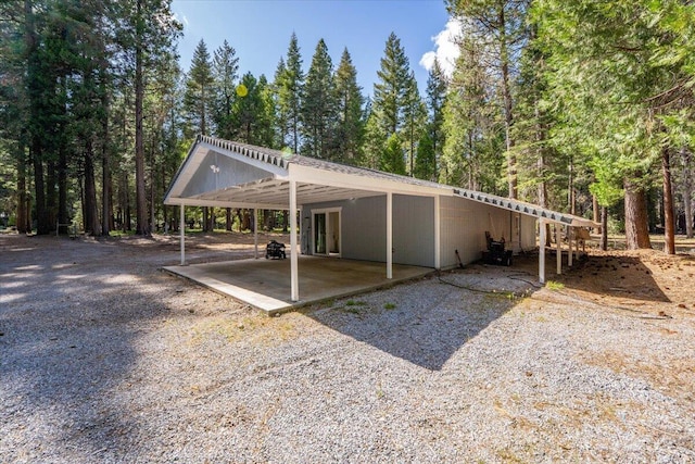 9279 Thatcher Mill Rd, Shingletown, CA 96088 - view of parking with a carport and driveway