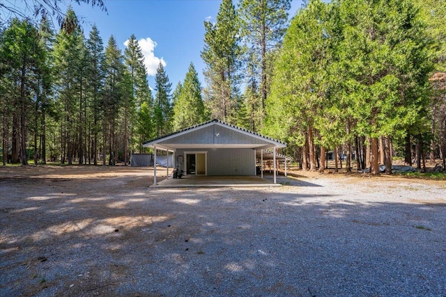 9279 Thatcher Mill Rd, Shingletown, CA 96088 - view of front of house with driveway and a wooded view