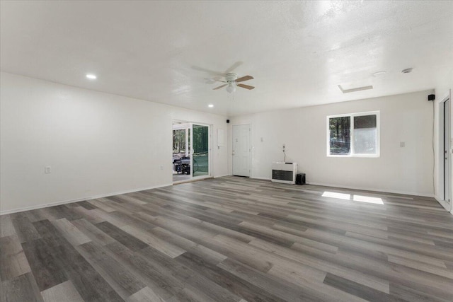 9279 Thatcher Mill Rd, Shingletown, CA 96088 - unfurnished living room with healthy amount of natural light, wood finished floors, recessed lighting, and a ceiling fan