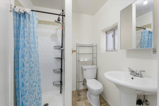 9279 Thatcher Mill Rd, Shingletown, CA 96088 - full bath featuring toilet, a stall shower, baseboards, and a sink