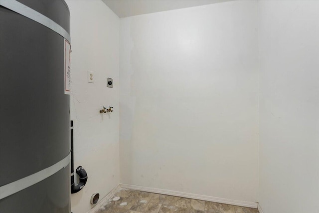9279 Thatcher Mill Rd, Shingletown, CA 96088 - laundry room featuring secured water heater, hookup for an electric dryer, baseboards, and hookup for a washing machine