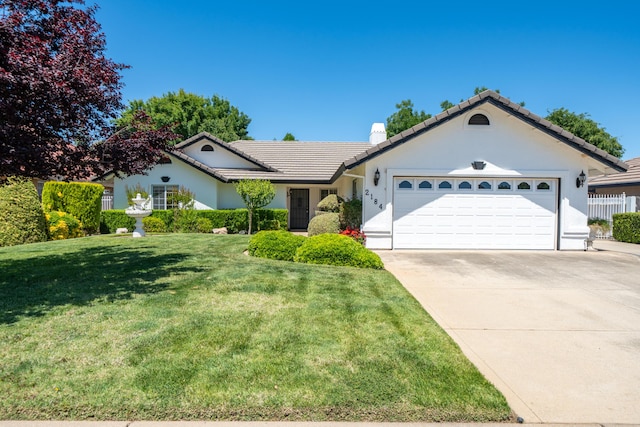 2184 Darsha Ln, Redding, CA 96003 - ranch-style home with a tile roof, an attached garage, concrete driveway, stucco siding, and a chimney