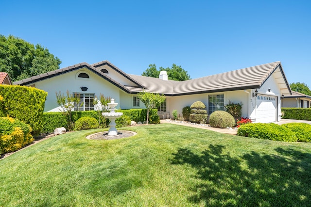 2184 Darsha Ln, Redding, CA 96003 - view of front of property featuring a tiled roof, a garage, a chimney, and a front yard