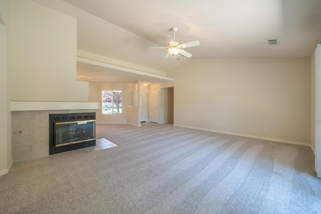 2184 Darsha Ln, Redding, CA 96003 - unfurnished living room with lofted ceiling, a ceiling fan, baseboards, a tile fireplace, and light carpet