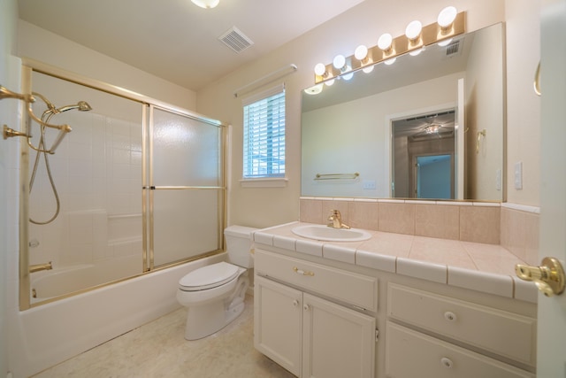 2184 Darsha Ln, Redding, CA 96003 - bathroom with vanity, toilet, and shower / bath combination with glass door