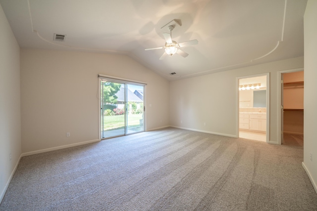 2184 Darsha Ln, Redding, CA 96003 - unfurnished bedroom with access to exterior, light carpet, lofted ceiling, baseboards, and ensuite bath