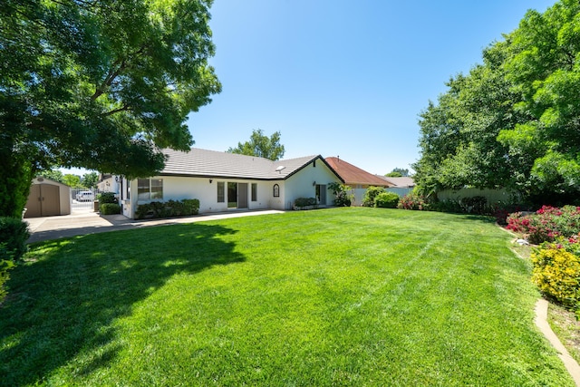 2184 Darsha Ln, Redding, CA 96003 - rear view of property with stucco siding, a tiled roof, and a patio area