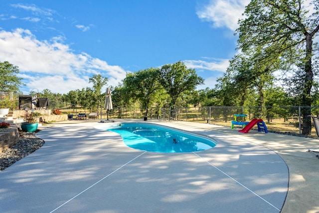 10844 Green Oaks Ln, Redding, CA 96003 - view of swimming pool with a patio area and view of wooded area